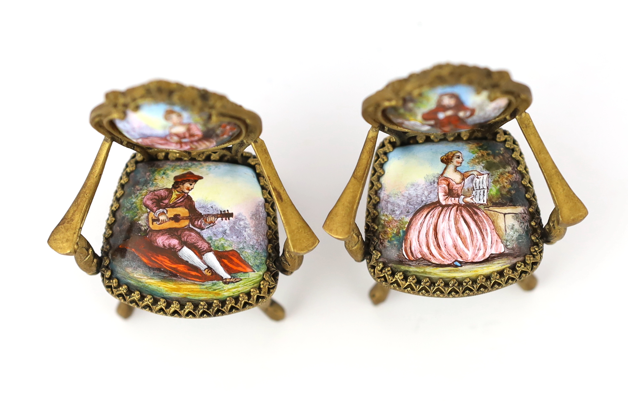 A 20th century Swiss enamel and ormolu musical miniature doll's house table with a pair of matching salon chairs, table 9.5 x 7.5cm, 5cm high, chairs 7cm high